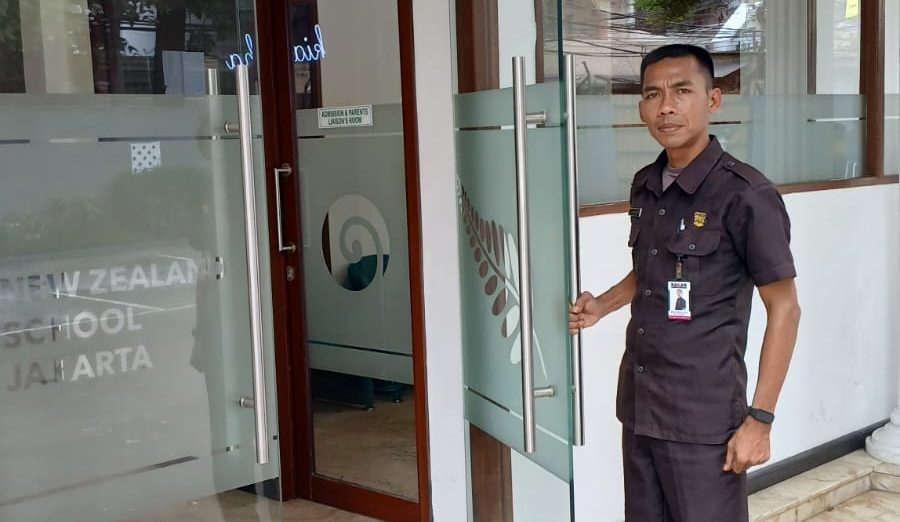 SAGAS security guard managing access at a school office entrance